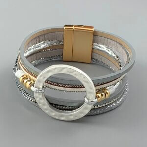 Silver strand cuff bracelet with matt silver ring feature and gold magnetic clasp