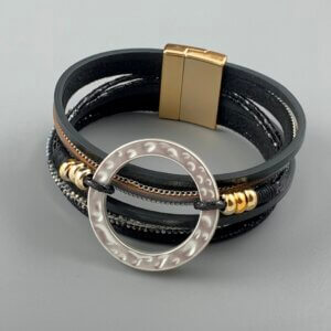 Black strand cuff bracelet with matt silver ring feature and gold magnetic clasp